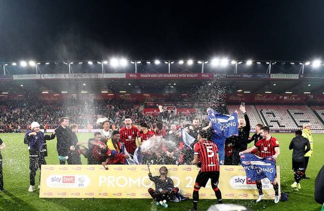 Mandatory Credit: Photo by James Marsh Shutterstock (12922043br) Bournemouth players celebrate after gaining promotion to the Premier League. AFC Bournemouth v Nottingham Forest, EFL Sky Bet Championship, Football, Vitality Stadium, Bournemouth, UK - 03 May 2022 EDITORIAL USE ONLY No use with unauthorised audio, video, data, fixture lists, club league logos or live services. Online in-match use limited to 120 images, no video emulation. No use in betting, games or single club league player publications. AFC Bournemouth v Nottingham Forest, EFL Sky Bet Championship, Football, Vitality Stadium, Bournemouth, UK - 03 May 2022 EDITORIAL USE ONLY No use with unauthorised audio, video, data, fixture lists, club league logos or live services. Online in-match use limited to 120 images, no video emulation. No use in betting, games or single club league player publications. Copyright: xJamesxMarsh Shutterstockx 12922043br