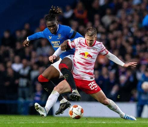 Mandatory Credit: Photo by Luke Nickerson Rangers FC Shutterstock (12926015t) Rangers Defender Calvin Bassey tackles RB Leipzig Midfielder Dani Olmo Rangers v RB Leipzig, UEFA Europa League, Semi Final, Second Leg, Football, Ibrox Stadium, Glasgow, UK - 05 May 2022 EDITORIAL USE ONLY No use with unauthorised audio, video, data, fixture lists, club league logos or live services. Online in-match use limited to 120 images, no video emulation. No use in betting, games or single club league player publications. Rangers v RB Leipzig, UEFA Europa League, Semi Final, Second Leg, Football, Ibrox Stadium, Glasgow, UK - 05 May 2022 EDITORIAL USE ONLY No use with unauthorised audio, video, data, fixture lists, club league logos or live services. Online in-match use limited to 120 images, no video emulation. No use in betting, games or single club league player publications. Copyright: xLukexNickerson RangersxFC Shutterstockx 12926015t