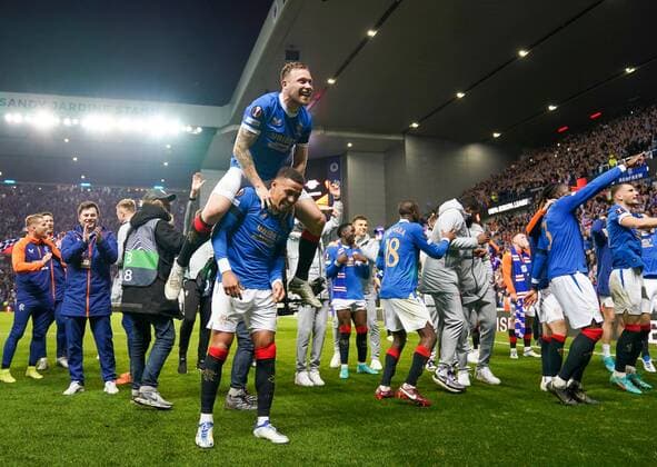 Mandatory Credit: Photo by Stuart Wallace Shutterstock (12925383bj) Scott Arfield of Rangers & Rangers Captain James Tavernier celebrates after the final whistle as Rangers progress to the UEFA Europa League Final after beating RB Leipzig 3-1 (agg. 3-2). Rangers v RB Leipzig, UEFA Europa League, Semi Final, Second Leg, Football, Ibrox Stadium, Glasgow, UK - 05 May 2022 EDITORIAL USE ONLY No use with unauthorised audio, video, data, fixture lists, club league logos or live services. Online in-match use limited to 120 images, no video emulation. No use in betting, games or single club league player publications. Rangers v RB Leipzig, UEFA Europa League, Semi Final, Second Leg, Football, Ibrox Stadium, Glasgow, UK - 05 May 2022 EDITORIAL USE ONLY No use with unauthorised audio, video, data, fixture lists, club league logos or live services. Online in-match use limited to 120 images, no video emulation. No use in betting, games or single club league player publications. Copyright: xStuartxWallace Shutterstockx 12925383bj