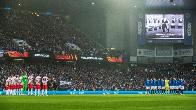 Mandatory Credit: Photo by Kirk O Rourke Rangers FC Shutterstock (12926021gd) Rangers & RB Leipzig players, management and fans during a moment silence for kitman Jimmy Bell during the Europa League Semi Final match against RB Leipzig at Ibrox Stadium, Glasgow. Rangers v RB Leipzig, UEFA Europa League, Semi Final, Second Leg, Football, Ibrox Stadium, Glasgow, UK - 05 May 2022 EDITORIAL USE ONLY No use with unauthorised audio, video, data, fixture lists, club league logos or live services. Online in-match use limited to 120 images, no video emulation. No use in betting, games or single club league player publications. Rangers v RB Leipzig, UEFA Europa League, Semi Final, Second Leg, Football, Ibrox Stadium, Glasgow, UK - 05 May 2022 EDITORIAL USE ONLY No use with unauthorised audio, video, data, fixture lists, club league logos or live services. Online in-match use limited to 120 images, no video emulation. No use in betting, games or single club league player publications. Copyright: xKirkxO Rourke RangersxFC Shutterstockx 12926021gd
