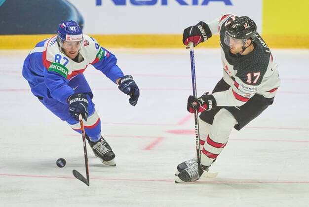 Adam Lowry Nr. 17 of Canada compete, fight for the puck against, Pavol Regenda, SVK 87 in the match SLOVAKIA - CANADA of the IIHF Ice hockey, Eishockey World Championship, WM, Weltmeisterschaft Group B in Helsinki, Finland, May 16, 2022, Season 2021 2022