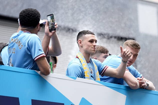 Mandatory Credit: Photo by Robbie Stephenson JMP Shutterstock (12953257ad) Phil Foden of Manchester City celebrates his sides Premier League title win during the open top bus parade Manchester City Champions Bus Parade, UK - 23 May 2022 EDITORIAL USE ONLY No use with unauthorised audio, video, data, fixture lists (outside the EU), club league logos or live services. Online in-match use limited to 45 images (+15 in extra time). No use to emulate moving images. No use in betting, games or single club league player publications services. Manchester City Champions Bus Parade, UK - 23 May 2022 EDITORIAL USE ONLY No use with unauthorised audio, video, data, fixture lists (outside the EU), club league logos or live services. Online in-match use limited to 45 images (+15 in extra time). No use to emulate moving images. No use in betting, games or Copyright: xRobbiexStephenson JMP Shutterstockx 12953257ad