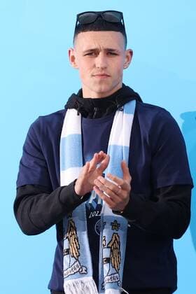 Mandatory Credit: Photo by Paul Greenwood Shutterstock (12952148be) Phil Foden of Manchester City during the Premier League trophy celebrations in Manchester City centre to celebrate winning the Premier League Manchester City Trophy Parade, Premier League, Football, Manchester, UK - 23 May 2022 EDITORIAL USE ONLY No use with unauthorised audio, video, data, fixture lists, club league logos or live services. Online in-match use limited to 120 images, no video emulation. No use in betting, games or single club league player publications. Manchester City Trophy Parade, Premier League, Football, Manchester, UK - 23 May 2022 EDITORIAL USE ONLY No use with unauthorised audio, video, data, fixture lists, club league logos or live services. Online in-match use limited to 120 images, no video emulation. No use in betting, games or single club league player publications. Copyright: xPaulxGreenwood Shutterstockx 12952148be