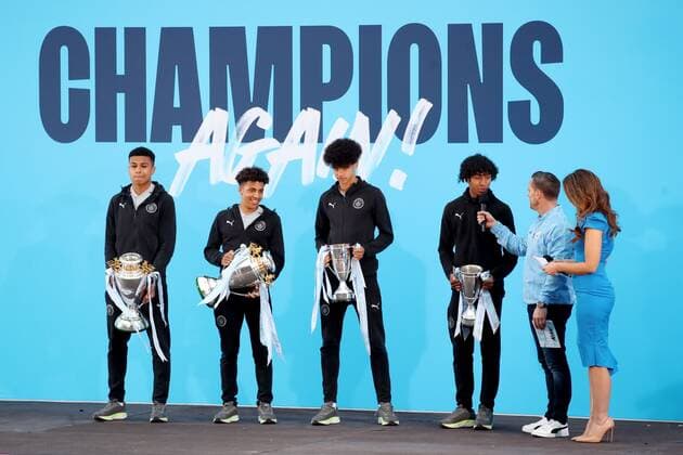 Mandatory Credit: Photo by Paul Greenwood Shutterstock (12952148bp) Manchester City players from the U16, U17, U 17 U18 and EDS teams celebrate on stage during the Premier League trophy celebrations in Manchester City centre to celebrate winning the Premier League Manchester City Trophy Parade, Premier League, Football, Manchester, UK - 23 May 2022 EDITORIAL USE ONLY No use with unauthorised audio, video, data, fixture lists, club league logos or live services. Online in-match use limited to 120 images, no video emulation. No use in betting, games or single club league player publications. Manchester City Trophy Parade, Premier League, Football, Manchester, UK - 23 May 2022 EDITORIAL USE ONLY No use with unauthorised audio, video, data, fixture lists, club league logos or live services. Online in-match use limited to 120 images, no video emulation. No use in betting, games or single club league player publications. Copyright: xPaulxGreenwood Shutterstockx 12952148bp