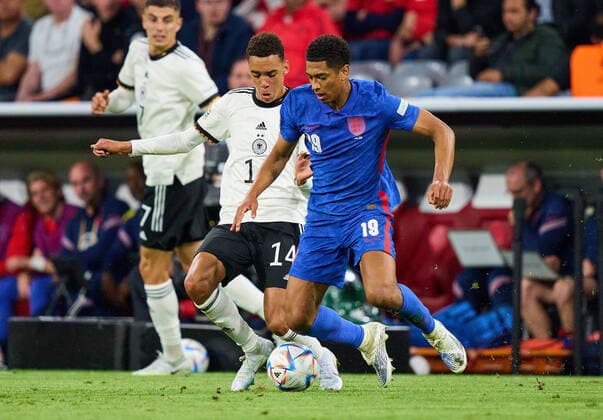 Jamal Musiala, DFB 14 compete for the ball, tackling, duel, header, zweikampf, action, fight against Jude Bellingham, England 19 in the UEFA Nations League 2022 match GERMANY - ENGLAND in Season 2022 2023 on Juni 07, 2022 in Munich, Germany.