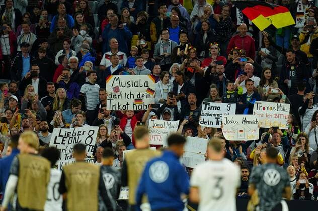 Mandatory Credit: Photo by Javier Garcia Shutterstock (12975315aq) Garmany fans with various banners requesting player shirts at full time Germany v England, UEFA Nations League, Group C, International Football, Allianz Arena, Munich, Germany - 07 Jun 2022 EDITORIAL USE ONLY No use with unauthorised audio, video, data, fixture lists, club league logos or live services. Online in-match use limited to 120 images, no video emulation. No use in betting, games or single club league player publications. Germany v England, UEFA Nations League, Group C, International Football, Allianz Arena, Munich, Germany - 07 Jun 2022 EDITORIAL USE ONLY No use with unauthorised audio, video, data, fixture lists, club league logos or live services. Online in-match use limited to 120 images, no video emulation. No use in betting, games or single club league player publications. Copyright: xJavierxGarcia Shutterstockx 12975315aq