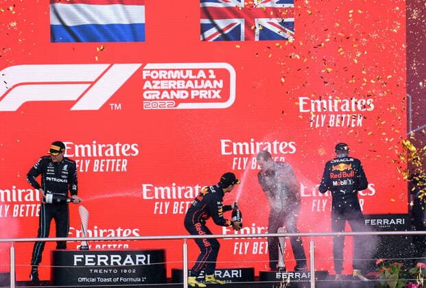 (220613) -- BAKU, June 13, 2022 -- Winner Red Bull driver Max Verstappen (2nd L) of the Netherlands, Red Bull team engineer Tom Hart (3rd L), second place Red Bull driver Sergio Perez (1st L) of Mexico, and third place Mercedes driver George Russell of Britain, celebrate during the awarding ceremony of the Azerbaijan Formula One Grand Prix at the Baku circuit, in Baku, Azerbaijan, June 12, 2022. ) (SP)AZERBAIJAN-BAKU-F1 AZERBAIJAN GRAND PRIX TofiqxBabayev