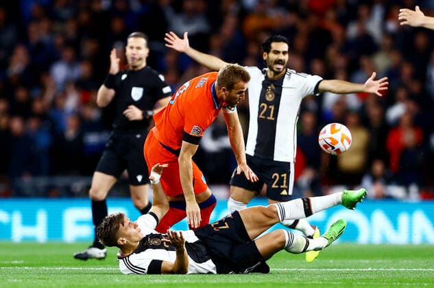 Mandatory Credit: Photo by Kieran McManus Shutterstock (13421401af) Harry Kane of England is tackled by Nico Schlotterbeck of Germany. England v Germany, UEFA Nations League, Group A3, International Football, Wembley Stadium, London, UK - 26 Sep 2022 EDITORIAL USE ONLY No use with unauthorised audio, video, data, fixture lists, club league logos or live services. Online in-match use limited to 120 images, no video emulation. No use in betting, games or single club league player publications. England v Germany, UEFA Nations League, Group A3, International Football, Wembley Stadium, London, UK - 26 Sep 2022 EDITORIAL USE ONLY No use with unauthorised audio, video, data, fixture lists, club league logos or live services. Online in-match use limited to 120 images, no video emulation. No use in betting, games or single club league player publications. Copyright: xKieranxMcManus Shutterstockx 13421401af