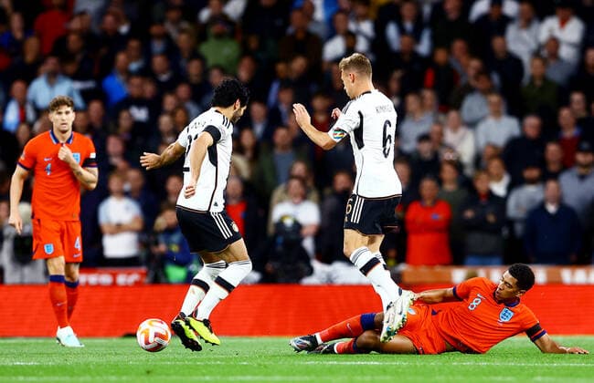 Mandatory Credit: Photo by Kieran McManus Shutterstock (13421401ao) Joshua Kimmich of Germany is tackled by Jude Bellingham of England. England v Germany, UEFA Nations League, Group A3, International Football, Wembley Stadium, London, UK - 26 Sep 2022 EDITORIAL USE ONLY No use with unauthorised audio, video, data, fixture lists, club league logos or live services. Online in-match use limited to 120 images, no video emulation. No use in betting, games or single club league player publications. England v Germany, UEFA Nations League, Group A3, International Football, Wembley Stadium, London, UK - 26 Sep 2022 EDITORIAL USE ONLY No use with unauthorised audio, video, data, fixture lists, club league logos or live services. Online in-match use limited to 120 images, no video emulation. No use in betting, games or single club league player publications. Copyright: xKieranxMcManus Shutterstockx 13421401ao