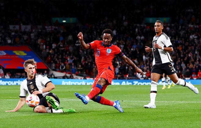 Mandatory Credit: Photo by Kieran McManus Shutterstock (13421401bu) Raheem Sterling of England has a shot. England v Germany, UEFA Nations League, Group A3, International Football, Wembley Stadium, London, UK - 26 Sep 2022 EDITORIAL USE ONLY No use with unauthorised audio, video, data, fixture lists, club league logos or live services. Online in-match use limited to 120 images, no video emulation. No use in betting, games or single club league player publications. England v Germany, UEFA Nations League, Group A3, International Football, Wembley Stadium, London, UK - 26 Sep 2022 EDITORIAL USE ONLY No use with unauthorised audio, video, data, fixture lists, club league logos or live services. Online in-match use limited to 120 images, no video emulation. No use in betting, games or single club league player publications. Copyright: xKieranxMcManus Shutterstockx 13421401bu