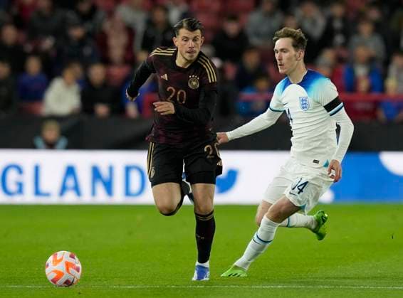 Sheffield, England, 27th September 2022. Lazar Samardzic of Germany and James Garner of England during the International Friendly, Länderspiel, Nationalmannschaft match at Bramall Lane, Sheffield. Picture credit should read: Andrew Yates Sportimage EDITORIAL USE ONLY. No use with unauthorised audio, video, data, fixture lists, club league logos or live services. Online in-match use limited to 120 images, no video emulation. No use in betting, games or single club league player publications. SPI-1910-0027