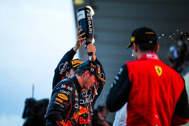 VERSTAPPEN Max (ned), Red Bull Racing RB18, celebrating race victory and World Championship, WM, Weltmeisterschaft on the podium with LECLERC Charles (mco), Scuderia Ferrari F1-75, and PEREZ Sergio (mex), Red Bull Racing RB18, portrait during the Formula 1 Honda Japanese Grand Prix 2022, 18th round of the 2022 FIA Formula One World Championship from Octobre 7 to 9, 2022 on the Suzuka International Racing Course, in Suzuka, Mie Prefecture, Japan - F1 - JAPANESE GRAND PRIX 2022 - RACE DPPI Panoramic 20221009_G00D1916