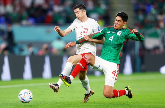 Mandatory Credit: Photo by Kieran McManus Shutterstock (13626428o) Robert Lewandowski of Poland and Edson Alvarez of Mexico. Mexico v Poland, FIFA World Cup, WM, Weltmeisterschaft, Fussball 2022, Group C, Football, Stadium 974, Doha, Qatar - 22 Nov 2022 Editorial Use Only Mexico v Poland, FIFA World Cup 2022, Group C, Football, Stadium 974, Doha, Qatar - 22 Nov 2022 Editorial Use Only Copyright: xKieranxMcManus Shutterstockx 13626428o