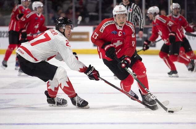 December 19, 2022, Moncton, NB, Canada: Canada™s Jack Matier, left, defends against Switzerland™s Attilio Biasca during third period IIHF World Junior Hockey Championship pre-tournament hockey action in Moncton, N.B., on Monday, Dec. 19, 2022. Canada News - December 19, 2022 - ZUMAc35_ 20221219_zaf_c35_070 Copyright: xRonxWardx