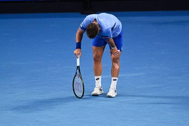 Mandatory Credit: Photo by James Gouley Shutterstock (13716770eq) Enzo Couacaud bends over during his second round match Australian Open, Day Four, Tennis, Melbourne Park, Melbourne, Australia - 19 Jan 2023 Australian Open, Day Four, Tennis, Melbourne Park, Melbourne, Australia - 19 Jan 2023 Copyright: xJamesxGouley Shutterstockx 13716770eq
