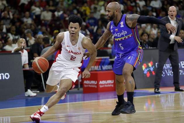 February 26, 2023, Caracas, Caracas Venezuela, Venezuela: CARACAS, VENEZUELA - FEBRUARY 26: Trae Bell-Haynes of Canada drives the ball against Gregory Vargas of Venezuela during the Americas qualifiers for the FIBA ‹â€¹Basketball World Cup 2023 basketball game, at Poliedro de Caracas, in Caracas, Venezuela, on February 26, 2023. Caracas Venezuela - ZUMAp175 20230226_zsa_p175_029 Copyright: xPedroxRancesxMatteyx