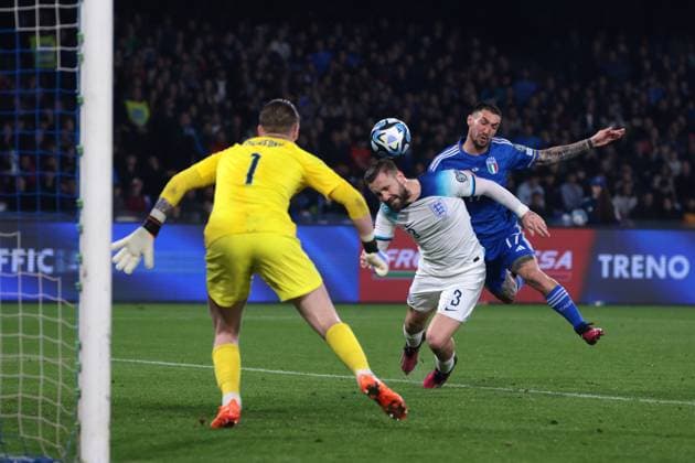 Naples, Italy, 23rd March 2023. Jordan Pickford of England looks on as Matteo Politano of Italy crashes into the back of Luke Shaw of England as he attempts to score during the UEFA European Championship, EM, Europameisterschaft Qualifying match at Stadio Diego Armando Maradona, Naples. Picture credit should read: Jonathan Moscrop Sportimage EDITORIAL USE ONLY. No use with unauthorised audio, video, data, fixture lists, club league logos or live services. Online in-match use limited to 120 images, no video emulation. No use in betting, games or single club league player publications. SPI-2317-0053