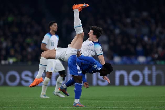 Naples, Italy, 23rd March 2023. Harry Maguire of England clashes with Wilfried Gnonto of Italy to head the ball away during the UEFA European Championship, EM, Europameisterschaft Qualifying match at Stadio Diego Armando Maradona, Naples. Picture credit should read: Jonathan Moscrop Sportimage EDITORIAL USE ONLY. No use with unauthorised audio, video, data, fixture lists, club league logos or live services. Online in-match use limited to 120 images, no video emulation. No use in betting, games or single club league player publications. SPI-2317-0056