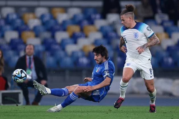 Naples, Italy, 23rd March 2023. Kalvin Phillips of England looks on as Sandro Tonali of Italy clears the ball during the UEFA European Championship, EM, Europameisterschaft Qualifying match at Stadio Diego Armando Maradona, Naples. Picture credit should read: Jonathan Moscrop Sportimage EDITORIAL USE ONLY. No use with unauthorised audio, video, data, fixture lists, club league logos or live services. Online in-match use limited to 120 images, no video emulation. No use in betting, games or single club league player publications. SPI-2317-0071
