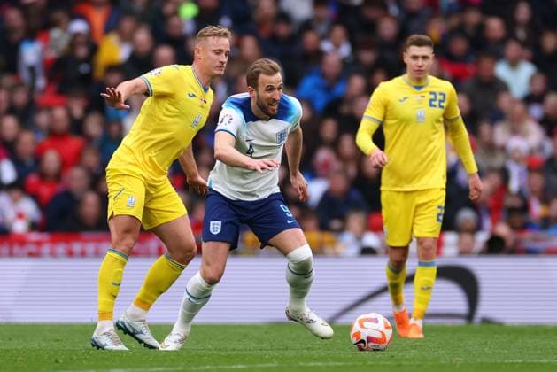 Mandatory Credit: Photo by Shutterstock (13844509z) Harry Kane of England in action with Oleksandr Svatok of Ukraine England v Ukraine, UEFA European Championship, EM, Europameisterschaft 2024 Qualifying, Group C, Football, Wembley Stadium, London, UK - 26 Mar 2023 EDITORIAL USE ONLY No use with unauthorised audio, video, data, fixture lists, club league logos or live services. Online in-match use limited to 120 images, no video emulation. No use in betting, games or single club league player publications. England v Ukraine, UEFA European Championship 2024 Qualifying, Group C, Football, Wembley Stadium, London, UK - 26 Mar 2023 EDITORIAL USE ONLY No use with unauthorised audio, video, data, fixture lists, club league logos or live services. Online in-match use limited to 120 images, no video emulation. No use in betting, games or single club league player publications. Copyright: xShutterstockx 13844509z