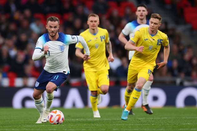 Mandatory Credit: Photo by Shutterstock (13844509bd) James Maddison of England in action with Vitaliy Buyalskiy and Viktor Tsygankov of Ukraine England v Ukraine, UEFA European Championship, EM, Europameisterschaft 2024 Qualifying, Group C, Football, Wembley Stadium, London, UK - 26 Mar 2023 EDITORIAL USE ONLY No use with unauthorised audio, video, data, fixture lists, club league logos or live services. Online in-match use limited to 120 images, no video emulation. No use in betting, games or single club league player publications. England v Ukraine, UEFA European Championship 2024 Qualifying, Group C, Football, Wembley Stadium, London, UK - 26 Mar 2023 EDITORIAL USE ONLY No use with unauthorised audio, video, data, fixture lists, club league logos or live services. Online in-match use limited to 120 images, no video emulation. No use in betting, games or single club league player publications. Copyright: xShutterstockx 13844509bd
