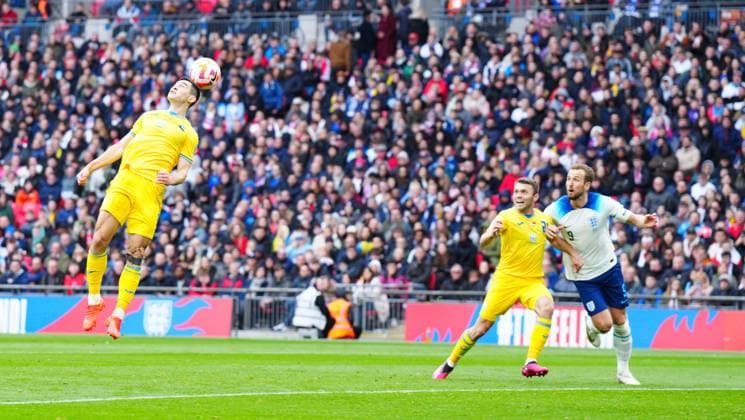 Mandatory Credit: Photo by Javier Garcia Shutterstock (13840577fk) Taras Stepanenko of Ukraine misses the ball and lets in Harry Kane of England to score the opening goal England v Ukraine, UEFA European Championship, EM, Europameisterschaft 2024 Qualifying, Group C, Football, Wembley Stadium, London, UK - 26 Mar 2023 EDITORIAL USE ONLY No use with unauthorised audio, video, data, fixture lists, club league logos or live services. Online in-match use limited to 120 images, no video emulation. No use in betting, games or single club league player publications. England v Ukraine, UEFA European Championship 2024 Qualifying, Group C, Football, Wembley Stadium, London, UK - 26 Mar 2023 EDITORIAL USE ONLY No use with unauthorised audio, video, data, fixture lists, club league logos or live services. Online in-match use limited to 120 images, no video emulation. No use in betting, games or single club league player publications. Copyright: xJavierxGarcia Shutterstockx 13840577fk