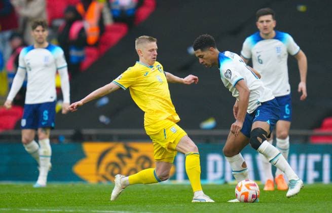 Mandatory Credit: Photo by Javier Garcia Shutterstock (13840577fr) Jude Bellingham of England takes on Oleksandr Zinchenko of Ukraine England v Ukraine, UEFA European Championship, EM, Europameisterschaft 2024 Qualifying, Group C, Football, Wembley Stadium, London, UK - 26 Mar 2023 EDITORIAL USE ONLY No use with unauthorised audio, video, data, fixture lists, club league logos or live services. Online in-match use limited to 120 images, no video emulation. No use in betting, games or single club league player publications. England v Ukraine, UEFA European Championship 2024 Qualifying, Group C, Football, Wembley Stadium, London, UK - 26 Mar 2023 EDITORIAL USE ONLY No use with unauthorised audio, video, data, fixture lists, club league logos or live services. Online in-match use limited to 120 images, no video emulation. No use in betting, games or single club league player publications. Copyright: xJavierxGarcia Shutterstockx 13840577fr