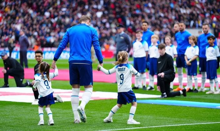 Mandatory Credit: Photo by Javier Garcia Shutterstock (13840577hw) Harry Kane of England walks out wth two of his children England v Ukraine, UEFA European Championship, EM, Europameisterschaft 2024 Qualifying, Group C, Football, Wembley Stadium, London, UK - 26 Mar 2023 EDITORIAL USE ONLY No use with unauthorised audio, video, data, fixture lists, club league logos or live services. Online in-match use limited to 120 images, no video emulation. No use in betting, games or single club league player publications. England v Ukraine, UEFA European Championship 2024 Qualifying, Group C, Football, Wembley Stadium, London, UK - 26 Mar 2023 EDITORIAL USE ONLY No use with unauthorised audio, video, data, fixture lists, club league logos or live services. Online in-match use limited to 120 images, no video emulation. No use in betting, games or single club league player publications. Copyright: xJavierxGarcia Shutterstockx 13840577hw
