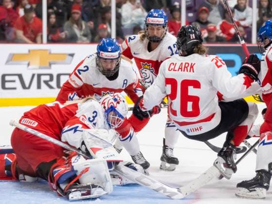 April 7, 2023, BRAMPTON, ON, CANADA: Canada forward Emily Clark (26) is flipped up as Czechia goaltender Blanka Skodova (31), defender Aneta Tejralova (2) and forward Klara Hymlarova (12) try to cover the puck during third period IIHF WomenöÄÃ s World Hockey Championship hockey action in Brampton, Ont., on Friday, April 7, 2023. Canada News - April 7, 2023 - ZUMAc35_ 20230407_zaf_c35_119 Copyright: xFrankxGunnx