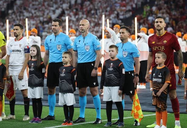 Budapest, Hungary, 31st May 2023. An all English refereeing set up at the Europa League Final Gary Beswick, Anthony Taylor and Adam Nunn on the field of play during the UEFA Europa League Final match at Pusks Arena, Budapest. Picture credit should read: David Klein Sportimage EDITORIAL USE ONLY. No use with unauthorised audio, video, data, fixture lists, club league logos or live services. Online in-match use limited to 120 images, no video emulation. No use in betting, games or single club league player publications. SPI-2471-0032