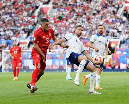 Manchester, England, 19th June 2023. Jordan Henderson of England tussles with Arijan Ademi of North Macedonia during the UEFA European Championship, EM, Europameisterschaft Qualifying match at Old Trafford, Manchester. Picture credit should read: Andrew Yates Sportimage EDITORIAL USE ONLY. No use with unauthorised audio, video, data, fixture lists, club league logos or live services. Online in-match use limited to 120 images, no video emulation. No use in betting, games or single club league player publications. SPI-2485-0028