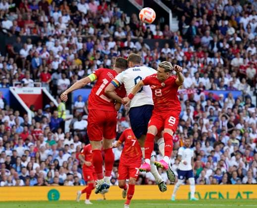 Manchester, England, 19th June 2023. Harry Kane of England clashes heads with Jovan Manev of North Macedonia during the UEFA European Championship, EM, Europameisterschaft Qualifying match at Old Trafford, Manchester. Picture credit should read: Andrew Yates Sportimage EDITORIAL USE ONLY. No use with unauthorised audio, video, data, fixture lists, club league logos or live services. Online in-match use limited to 120 images, no video emulation. No use in betting, games or single club league player publications. SPI-2485-0037