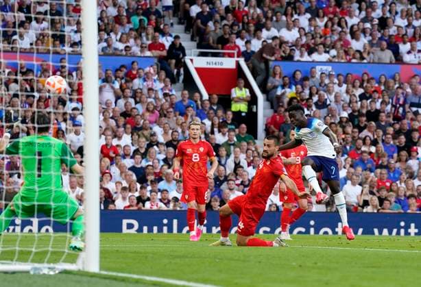 Manchester, England, 19th June 2023. Bukayo Saka of England scoring his sides second goal during the UEFA European Championship, EM, Europameisterschaft Qualifying match at Old Trafford, Manchester. Picture credit should read: Andrew Yates Sportimage EDITORIAL USE ONLY. No use with unauthorised audio, video, data, fixture lists, club league logos or live services. Online in-match use limited to 120 images, no video emulation. No use in betting, games or single club league player publications. SPI-2485-0051