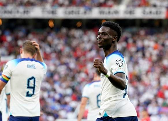 Manchester, England, 19th June 2023. Bukayo Saka of England celebrates scoring his sides second goal during the UEFA European Championship, EM, Europameisterschaft Qualifying match at Old Trafford, Manchester. Picture credit should read: Andrew Yates Sportimage EDITORIAL USE ONLY. No use with unauthorised audio, video, data, fixture lists, club league logos or live services. Online in-match use limited to 120 images, no video emulation. No use in betting, games or single club league player publications. SPI-2485-0058