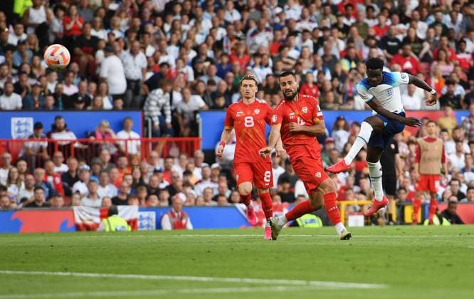 Mandatory Credit: Photo by Anna Gowthorpe Shutterstock (13975202u) Bukayo Saka of England scores his side s fourth goal England v North Macedonia, UEFA European Championship, EM, Europameisterschaft 2024 Qualifying, Group C, Football, Old Trafford, Manchester, UK - 19 June 2023 EDITORIAL USE ONLY No use with unauthorised audio, video, data, fixture lists, club league logos or live services. Online in-match use limited to 120 images, no video emulation. No use in betting, games or single club league player publications. England v North Macedonia, UEFA European Championship 2024 Qualifying, Group C, Football, Old Trafford, Manchester, UK - 19 June 2023 EDITORIAL USE ONLY No use with unauthorised audio, video, data, fixture lists, club league logos or live services. Online in-match use limited to 120 images, no video emulation. No use in betting, games or single club league player publications. Copyright: xAnnaxGowthorpe Shutterstockx 13975202u