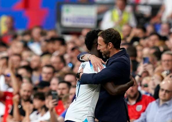Manchester, England, 19th June 2023. Bukayo Saka of England shakes hands with Gareth Southgate manager of England during the UEFA European Championship, EM, Europameisterschaft Qualifying match at Old Trafford, Manchester. Picture credit should read: Andrew Yates Sportimage EDITORIAL USE ONLY. No use with unauthorised audio, video, data, fixture lists, club league logos or live services. Online in-match use limited to 120 images, no video emulation. No use in betting, games or single club league player publications. SPI-2485-0087