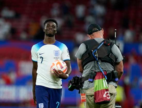Manchester, England, 19th June 2023. Bukayo Saka of England celebrates at the final whistle with the match ball during the UEFA European Championship, EM, Europameisterschaft Qualifying match at Old Trafford, Manchester. Picture credit should read: Andrew Yates Sportimage EDITORIAL USE ONLY. No use with unauthorised audio, video, data, fixture lists, club league logos or live services. Online in-match use limited to 120 images, no video emulation. No use in betting, games or single club league player publications. SPI-2485-0098