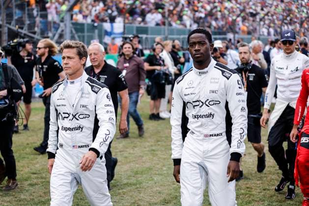 Sport Bilder des Tages PITT Brad (USA), actor playing Sonny Hayes, driver of the fictional Apex APXGP team in the F1 movie by Apple Studios Bruckheimer Films, portrait IDRIS Damson Alade-Bo (GBR), actor playing Joshua Pearce, driver of the fictional Apex APXGP team in the F1 movie by Apple Studios Bruckheimer Films, portrait during the 2023 Formula 1 Aramco British Grand Prix, 10th round of the 2023 Formula One World Championship, WM, Weltmeisterschaft from July 7 to 9, 2023 on the Silverstone Circuit, in Silverstone, United Kingdom - F1 - BRITISH GRAND PRIX 2023 - RACE DPPI Panoramic 03323013__R5_9377