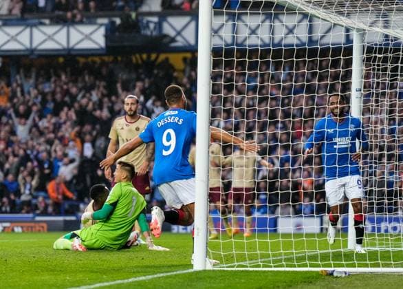 Mandatory Credit: Photo by Stuart Wallace Shutterstock (14047767v) Cyriel Dessers of Rangers scores to give Rangers a 2-0 lead. Rangers v Servette, UEFA Champions League, Third Qualifying Round, Football, Ibrox Stadium, Glasgow, UK - 09 Aug 2023 EDITORIAL USE ONLY No use with unauthorised audio, video, data, fixture lists, club league logos or live services. Online in-match use limited to 120 images, no video emulation. No use in betting, games or single club league player publications. Rangers v Servette, UEFA Champions League, Third Qualifying Round, Football, Ibrox Stadium, Glasgow, UK - 09 Aug 2023 EDITORIAL USE ONLY No use with unauthorised audio, video, data, fixture lists, club league logos or live services. Online in-match use limited to 120 images, no video emulation. No use in betting, games or single club league player publications. Copyright: xStuartxWallace Shutterstockx 14047767v