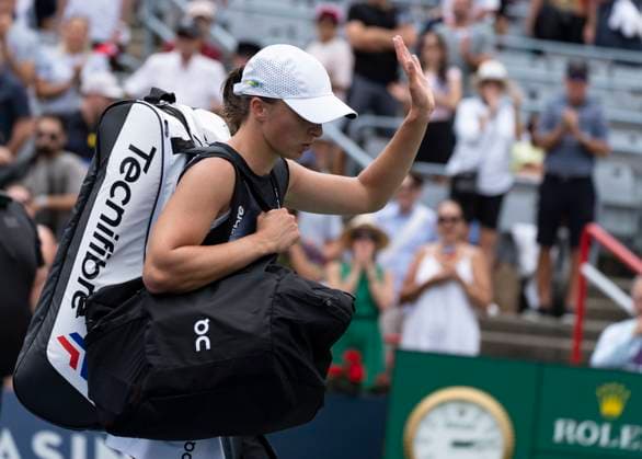 August 12, 2023, MONTREAL, PQ, Canada: Iga Swiatek of Poland, waves as she exits the court following her loss to Jessica Pegula of the United States, during semifinal action at the National Bank Open tennis tournament in Montreal, Saturday, Aug. 12, 2023. Canada News - August 12, 2023 - ZUMAc35_ 20230812_zaf_c35_027 Copyright: xChristinnexMuschix