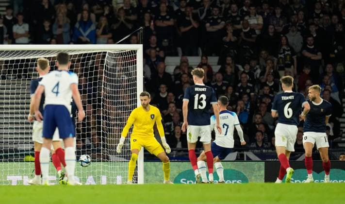 Mandatory Credit: Photo by Stuart Wallace Shutterstock (14094533n) Phil Foden of England scores past Scotland goalkeeper Angus Gunn to give England a 0-1 lead. Scotland v England, International Friendly, Länderspiel, Nationalmannschaft Football, Hampden Park, Glasgow, UK - 12 Sep 2023 EDITORIAL USE ONLY No use with unauthorised audio, video, data, fixture lists, club league logos or live services. Online in-match use limited to 120 images, no video emulation. No use in betting, games or single club league player publications. Scotland v England, International Friendly, Football, Hampden Park, Glasgow, UK - 12 Sep 2023 EDITORIAL USE ONLY No use with unauthorised audio, video, data, fixture lists, club league logos or live services. Online in-match use limited to 120 images, no video emulation. No use in betting, games or single club league player publications. Copyright: xStuartxWallace Shutterstockx 14094533n