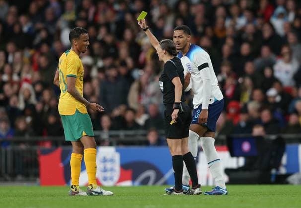 England v Australia, International Friendly, Länderspiel, Nationalmannschaft Match, Wembley Stadium, London, UK - 13th October 2023 Keanu Baccus of Australia & St Mirren & Levi Colwill of England & Chelsea are shown yellow cards by Referee, Stephanie Frappart. - England v Australia, International Friendly Match, Wembley Stadium, London, UK - 13th October 2023. London Wembley Stadium UK Copyright: xDanxWeirx CP_England_Australia_67