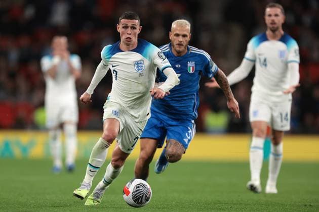London, England, 17th October 2023. Phil Foden of England is pursued by Federico Dimarco of Italy as he breaks with the ball during the UEFA European Championship, EM, Europameisterschaft Qualifying match at Wembley Stadium, London. Picture credit should read: Jonathan Moscrop Sportimage EDITORIAL USE ONLY. No use with unauthorised audio, video, data, fixture lists, club league logos or live services. Online in-match use limited to 120 images, no video emulation. No use in betting, games or single club league player publications. SPI-2650-0051