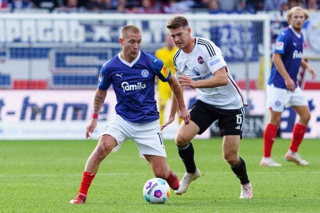 Lewis Holtby (Holstein Kiel, 10), Florian Flick (1. FC Nuernberg, 06) GER, Holstein Kiel vs. 1. FC Nuernberg, Fussball, 2. Bundesliga, Spieltag 11, Spielzeit 2023 2024, 29.10.2023 DFL REGULATIONS PROHIBIT ANY USE OF PHOTOGRAPHS AS IMAGE SEQUENCES AND OR QUASI-VIDEO GER, Holstein Kiel vs. 1. FC Nuernberg, Fussball, 2. Bundesliga, Spieltag 11, Spielzeit 2023 2024, 29.10.2023 Kiel Copyright: xEibner-Pressefoto MarcelxvonxFehrnx EP_MFN
