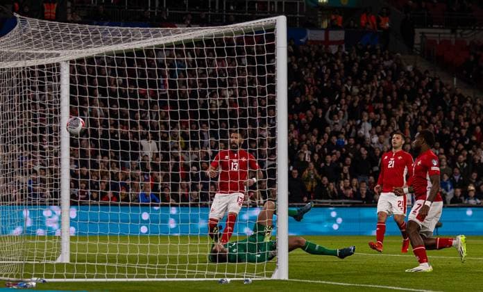 (231118) -- LONDON, Nov. 18, 2023 -- Enrico Pepe (1st L) of Malta scores an own goal during the UEFA EURO, EM, Europameisterschaft,Fussball 2024 Group C qualification match between England and Malta in London, Britain on Nov. 17, 2023. FOR EDITORIAL USE ONLY. NOT FOR SALE FOR MARKETING OR ADVERTISING CAMPAIGNS. NO USE WITH UNAUTHORIZED AUDIO, VIDEO, DATA, FIXTURE LISTS, CLUB LEAGUE LOGOS OR LIVE SERVICES. ONLINE IN-MATCH USE LIMITED TO 45 IMAGES, NO VIDEO EMULATION. NO USE IN BETTING, GAMES OR SINGLE CLUB LEAGUE PLAYER PUBLICATIONS. (SP)BRITAIN-LONDON-FOOTBALL-UEFA EURO 2024-QUALIFIERS (Xinhua)