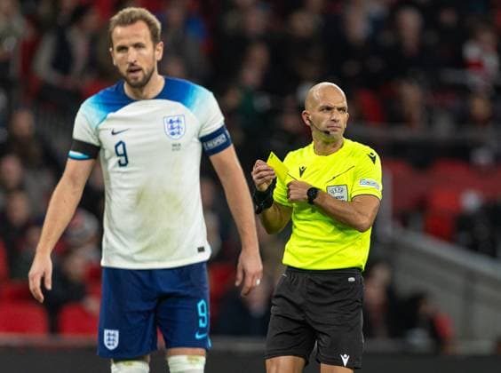(231118) -- LONDON, Nov. 18, 2023 -- Harry Kane (L) of England reacts after being shown a yellow card by referee Luis Godinho during the UEFA EURO, EM, Europameisterschaft,Fussball 2024 Group C qualification match between England and Malta in London, Britain on Nov. 17, 2023. FOR EDITORIAL USE ONLY. NOT FOR SALE FOR MARKETING OR ADVERTISING CAMPAIGNS. NO USE WITH UNAUTHORIZED AUDIO, VIDEO, DATA, FIXTURE LISTS, CLUB LEAGUE LOGOS OR LIVE SERVICES. ONLINE IN-MATCH USE LIMITED TO 45 IMAGES, NO VIDEO EMULATION. NO USE IN BETTING, GAMES OR SINGLE CLUB LEAGUE PLAYER PUBLICATIONS. (SP)BRITAIN-LONDON-FOOTBALL-UEFA EURO 2024-QUALIFIERS (Xinhua)
