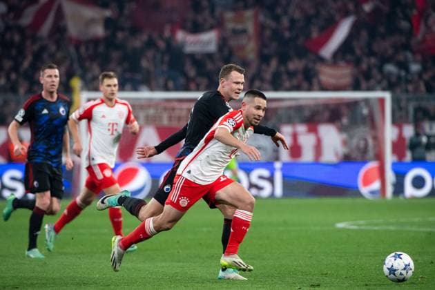 Raphael Guerreiro (FC Bayern Muenchen, 22) im Zweikampf mit Viktor Claesson (FC Kopenhagen, 07), GER, FC Bayern Muenchen (FCB) vs FC Kopenhagen (FCK), Fussball, UEFA Champions League, 5. Spieltag, Gruppe A, Saison 2023 2024, 29.11.2023 DFB DFL regulations prohibit any use of photographs as image sequences and or quasi-video GER, FC Bayern Muenchen (FCB) vs FC Kopenhagen (FCK), Fussball, UEFA Champions League, 5. Spieltag, Gruppe A, Saison 2023 2024, 29.11.2023 Muenchen Copyright: xEibner-Pressefoto Memmlerx EP_MMR