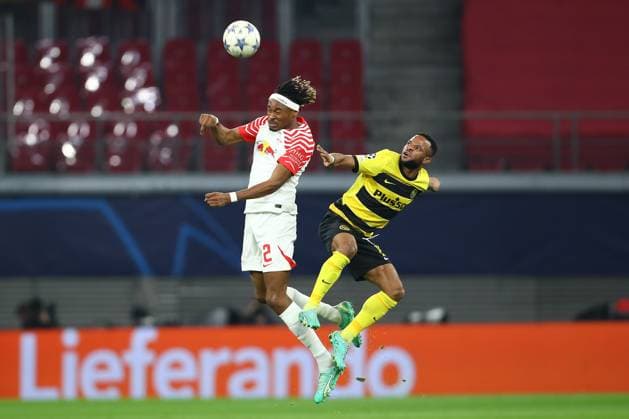 13.12.2023, xtgx, Fussball UEFA Champions League, RB Leipzig - Young Boys Bern emspor, v.l. Mohamed Simakan (Leipzig, 2), Meschack Elia (Bern, 15) Zweikampf, Duell, Kampf, tackle (DFL DFB REGULATIONS PROHIBIT ANY USE OF PHOTOGRAPHS as IMAGE SEQUENCES and or QUASI-VIDEO) Leipzig