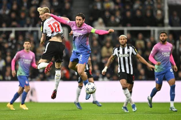 Anthony Gordon of Newcastle United battles with Davide Calabria of AC Milan Newcastle United v AC Milan, UEFA Champions League, Group F, Football, St James Park, Newcastle, UK - 13 Dec 2023 EDITORIAL USE ONLY No use with unauthorised audio, video, data, fixture lists, club league logos or live services. Online in-match use limited to 120 images, no video emulation. No use in betting, games or single club league player publications. Copyright: xRichardxLee Shutterstockx 14254244am