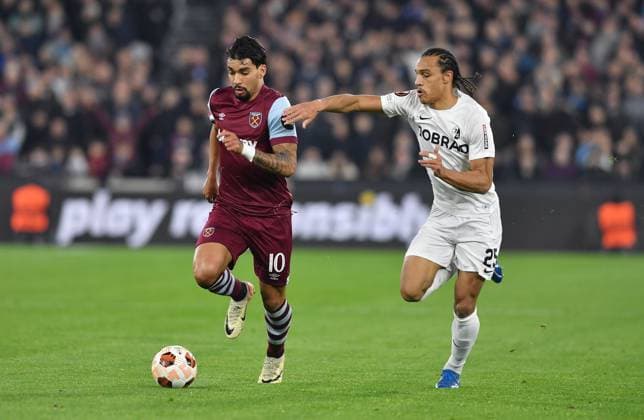 Lucas Paqueta of West Ham United is challenged by Kiliann Sildillia of SC Freiberg West Ham United v Freiburg, UEFA Europa League, Group A, Football, London Arena, London, UK - 14 Dec 2023 EDITORIAL USE ONLY No use with unauthorised audio, video, data, fixture lists, club league logos or live services. Online in-match use limited to 120 images, no video emulation. No use in betting, games or single club league player publications. Copyright: xAlanxWalter Shutterstockx 14254269u